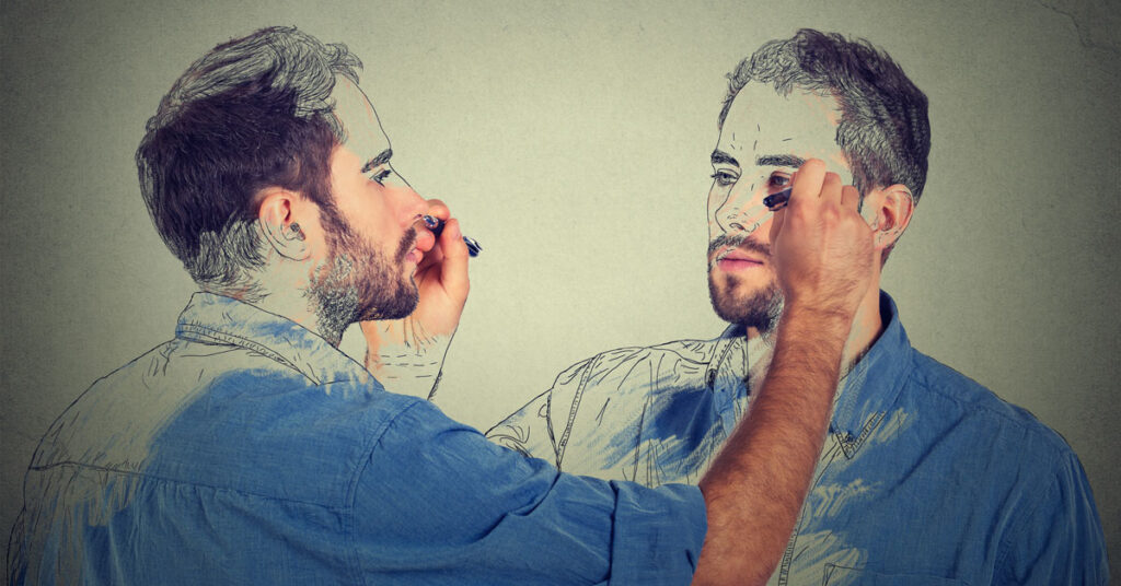 Man drawing his reflection