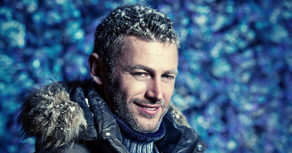 Snow in a man's hair during the winter