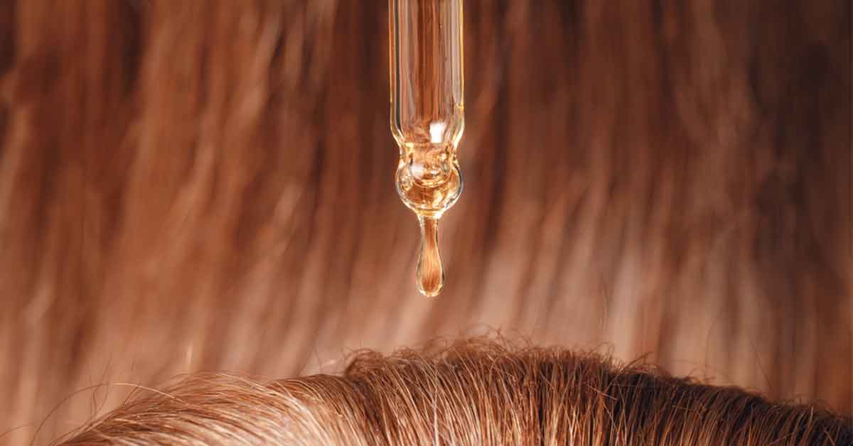 Bear oil being applied to hair
